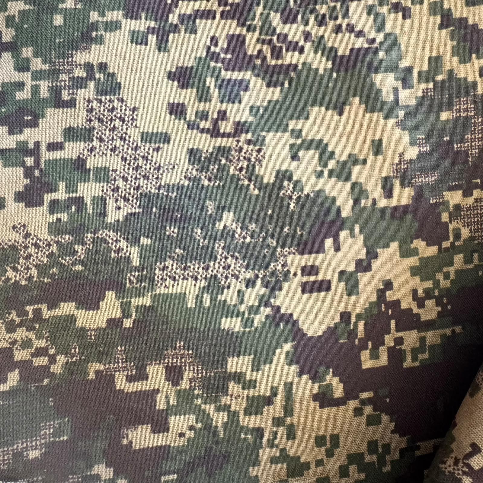 Close view of a digital camouflage fabric pattern