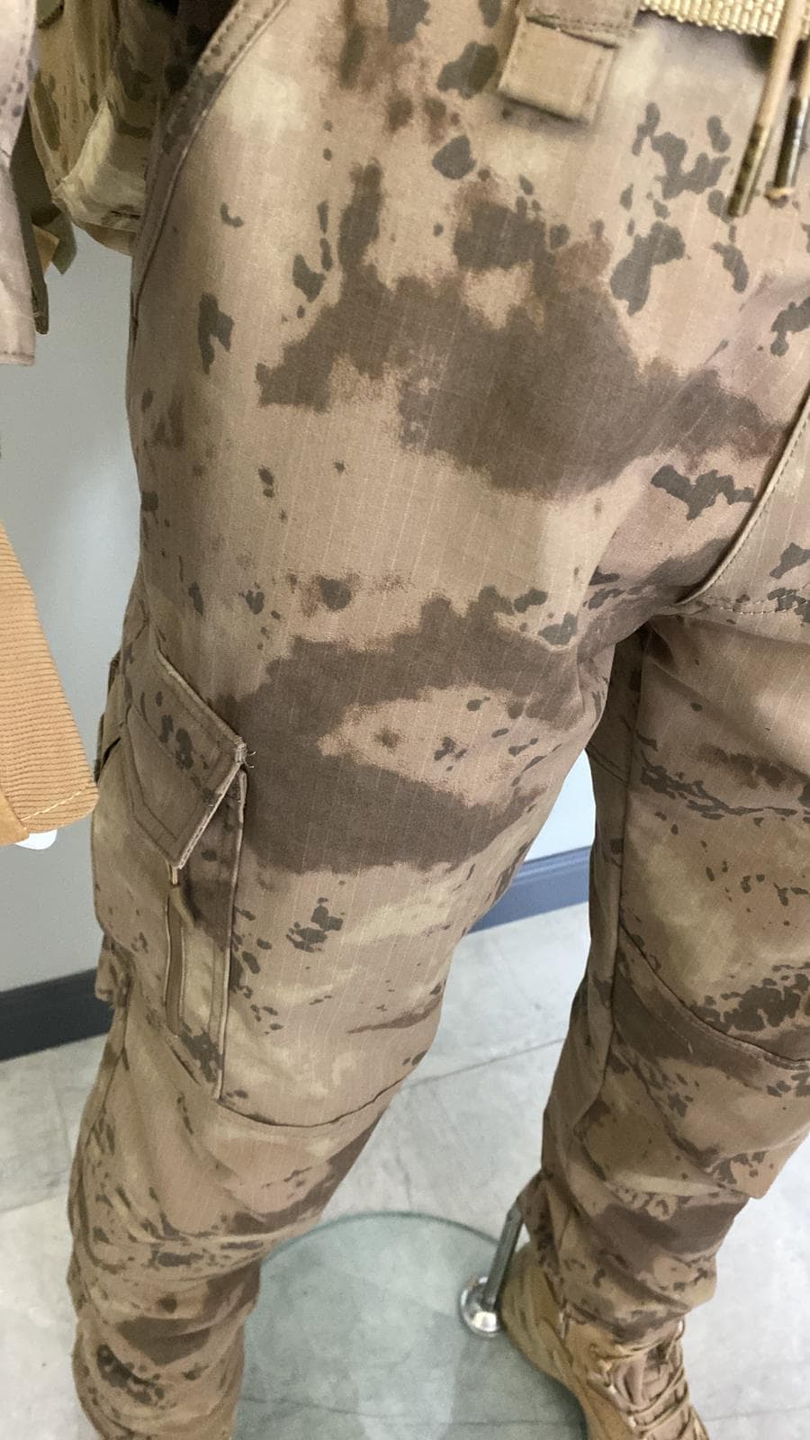 Camouflage uniform garment showing construction and pockets